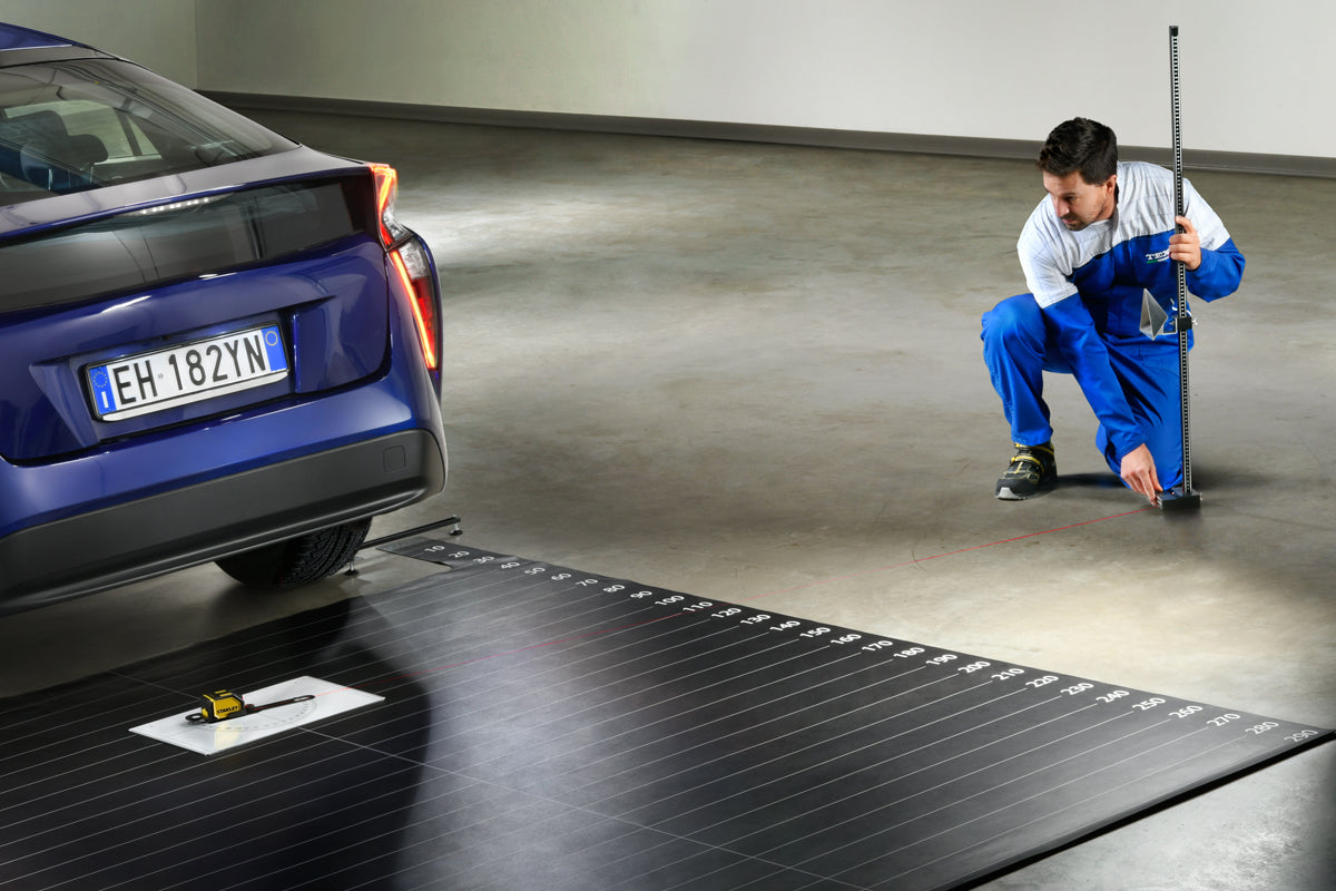 Technician using RCCS3 to calibrate vehicle systems